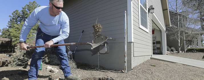 Man digging with shovel