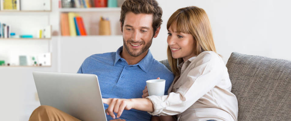 UES Home Energy Calculator Couple looking at laptop