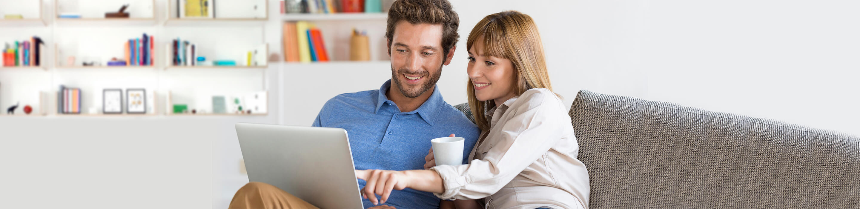 UES Home Energy Calculator Couple looking at laptop