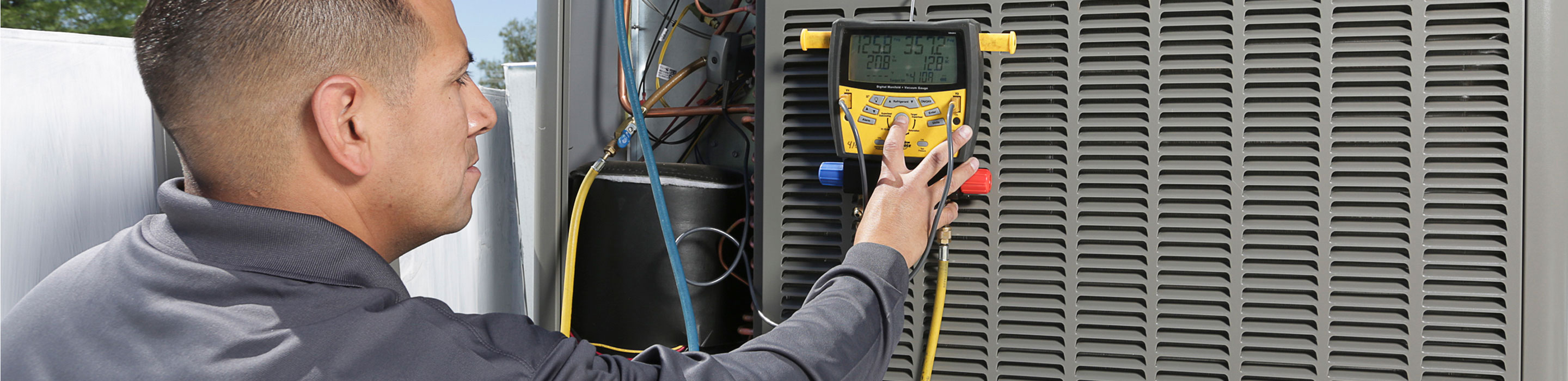 UES-Efficient-Home-Program Technician working on ac unit
