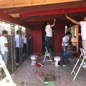 UES-Rebuilding-Together-Santa-Cruz-County,-Inc-Photo Working on a house